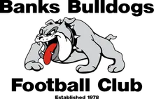 Logo for Banks Bulldogs Football Club, featuring a cartoon bulldog with a spiked collar, growling and crouched aggressively. Text above and below reads "Banks Bulldogs Football Club. Established 1978.