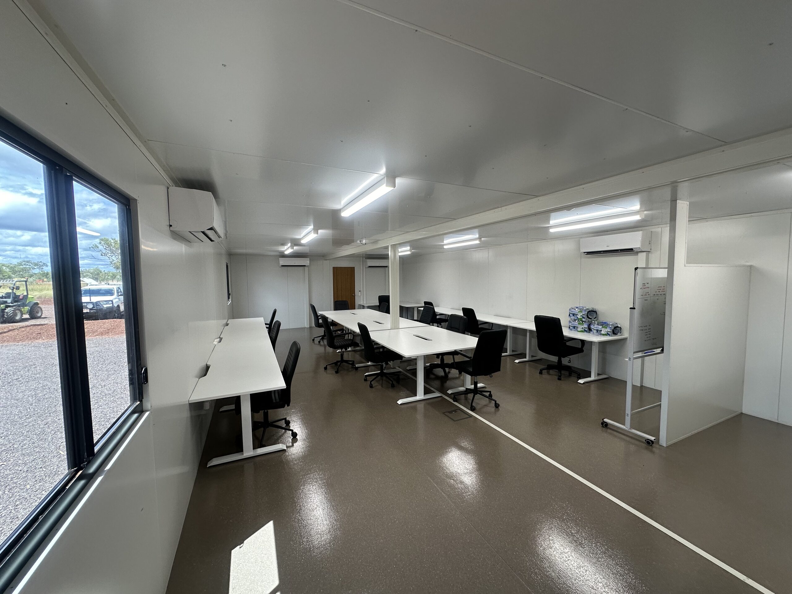 Interior of a Northern Transportables modular office fitted out with desks and meeting space