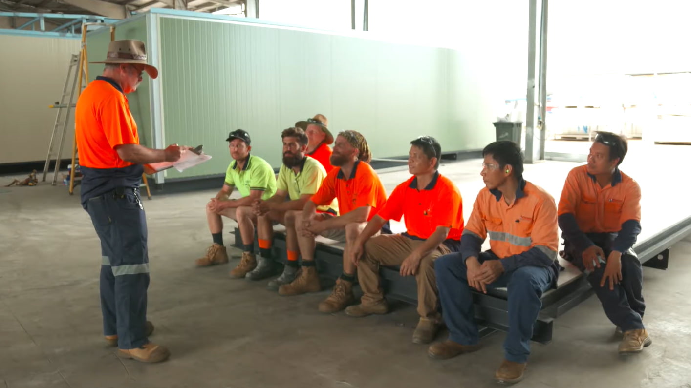 A Northern Transportables supervisor briefing the crew in the Darwin factory